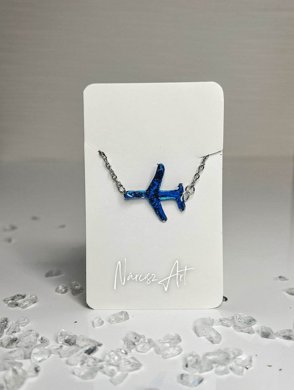 Repülő formájú epoxi gyanta karkötő, több színben